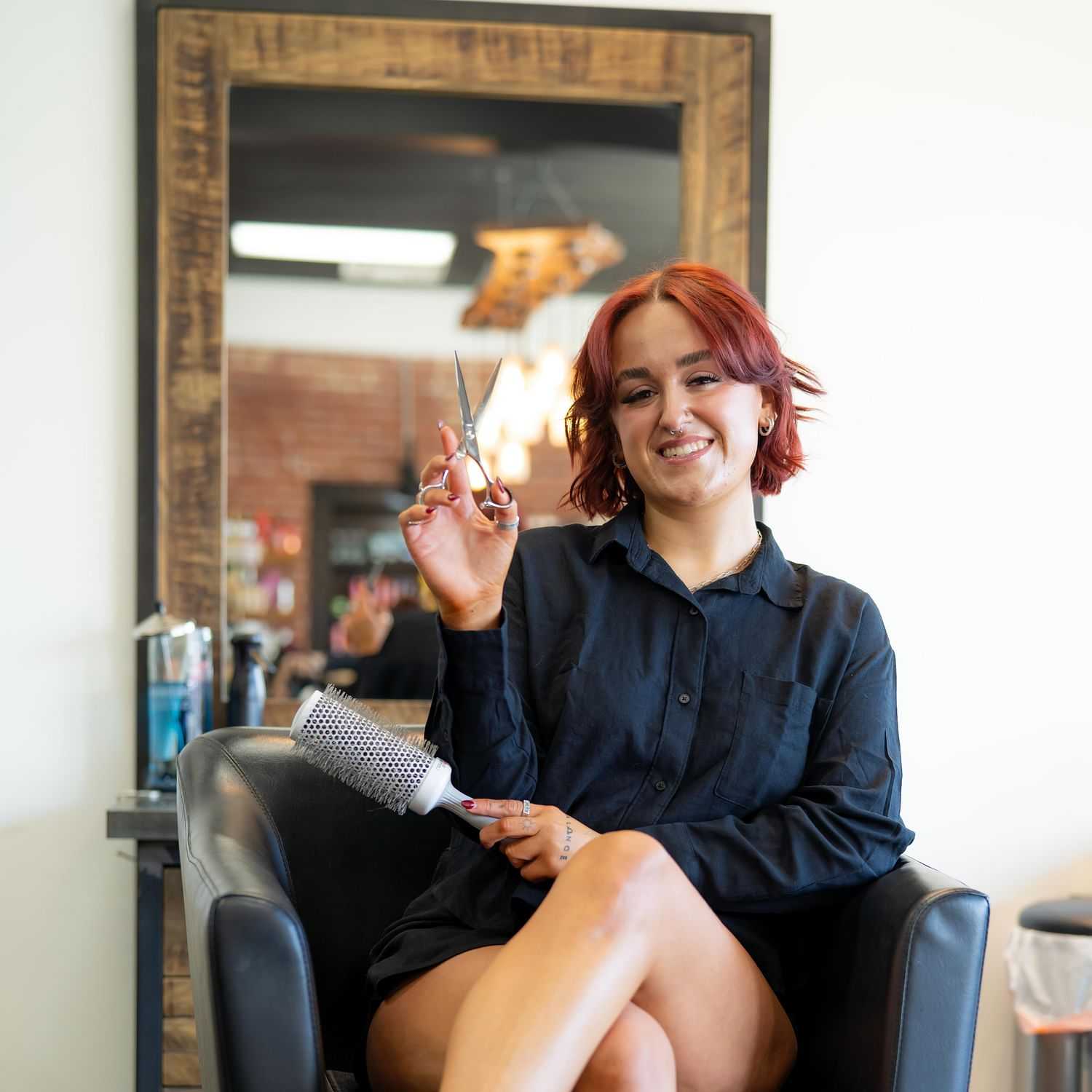 Portrait of Haley, a professional stylist at Elevate Hair Studio by Tricia Cosgrove, showcasing their expertise and style.